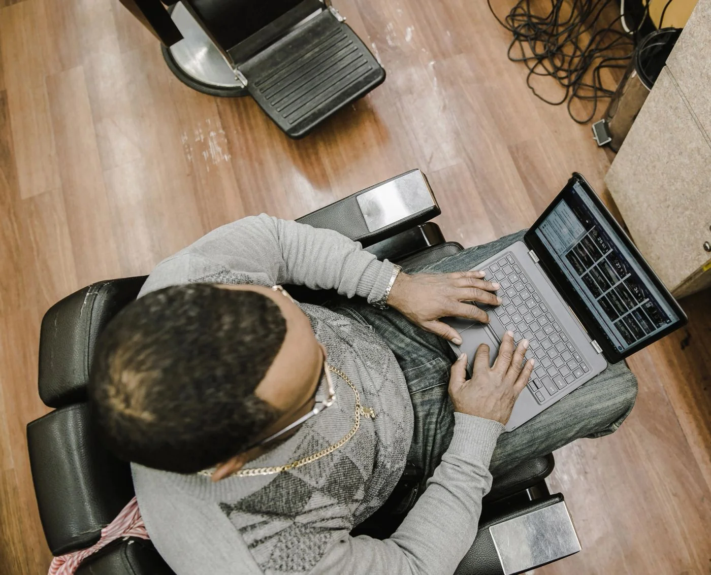Professional working remotely with a laptop and headphones